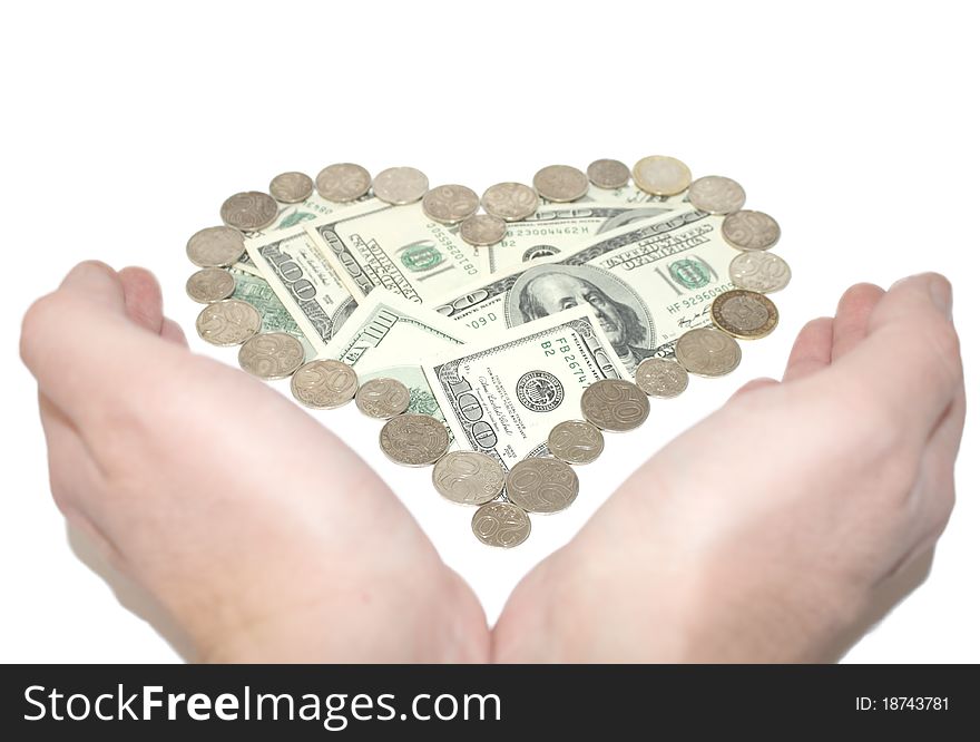 Photo of dollars in the heart surrounded by coins; arms. Association with the protection; savings; accumulation, protection, wealth. Photo of dollars in the heart surrounded by coins; arms. Association with the protection; savings; accumulation, protection, wealth