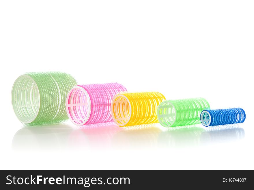 Multicolored hair curlers isolated over white background. Multicolored hair curlers isolated over white background