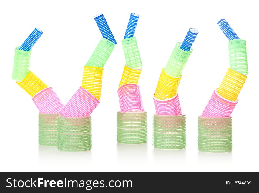 Multicolored hair curlers isolated over white background. Multicolored hair curlers isolated over white background