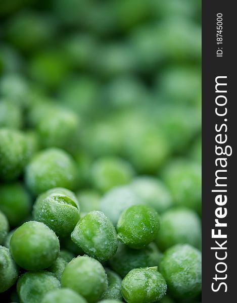 Macro photo of frozen green peas