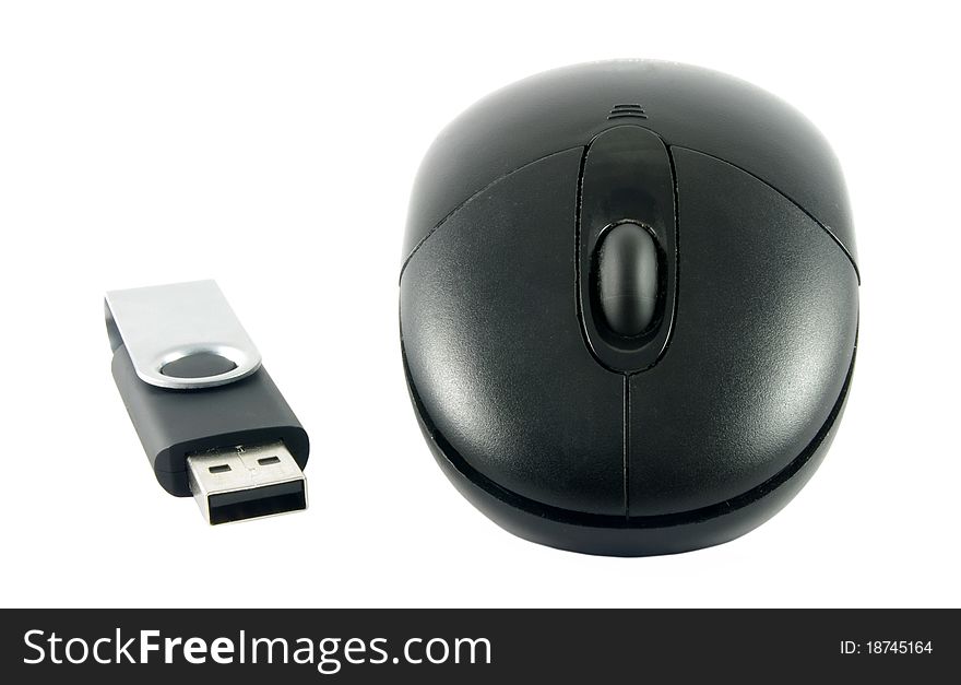 Black computer mouse with USB memory stick over white