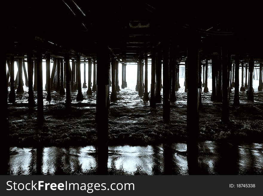 The walkway beneath the famous Santa Monica Pier holds a mysterious beauty all its own. The walkway beneath the famous Santa Monica Pier holds a mysterious beauty all its own.