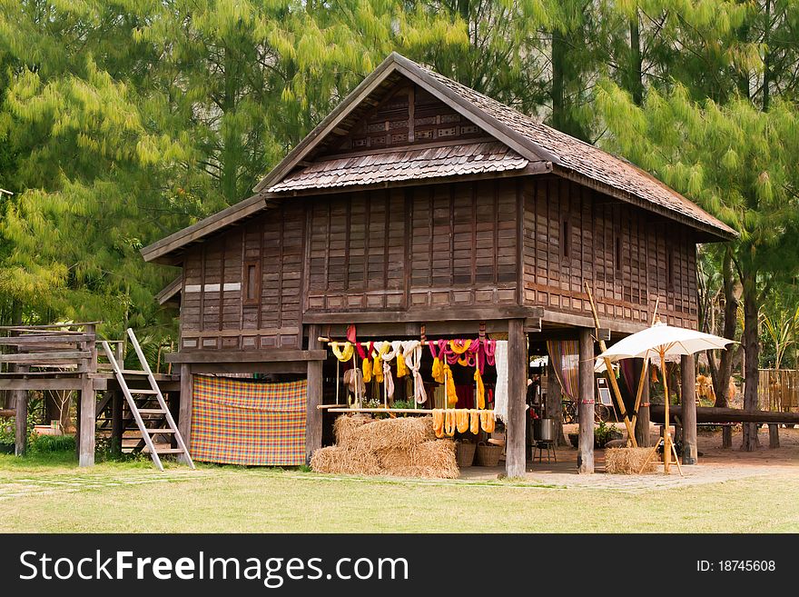 Asian old hut with green tree