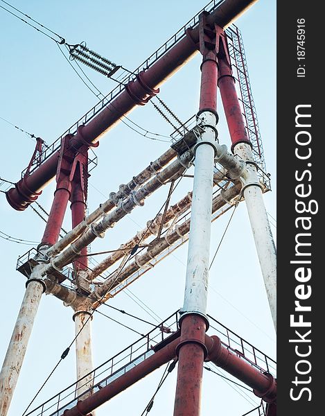 Electric high voltage post with the sky background