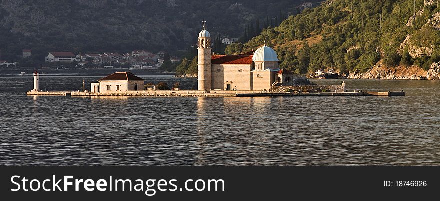 Small island called Our-Lady-Of-The-Rock on the Bay of Kotor offshore of Perast town with a church erected in 1630. Small island called Our-Lady-Of-The-Rock on the Bay of Kotor offshore of Perast town with a church erected in 1630