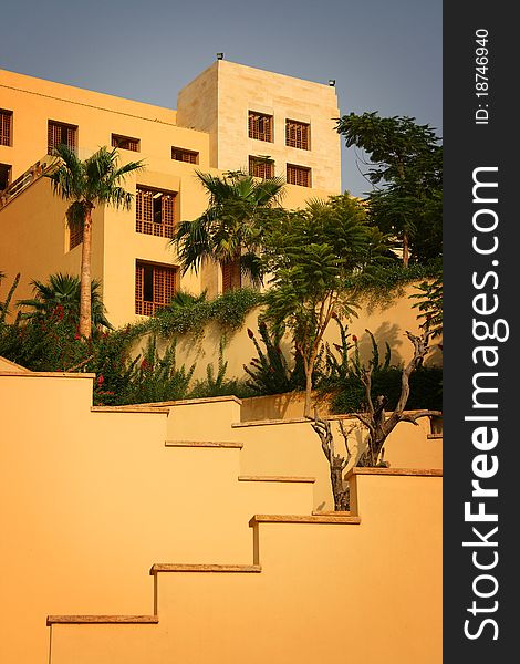 Geometry of a hotel building in a resort by the Dead Sea at the time of sunset. Geometry of a hotel building in a resort by the Dead Sea at the time of sunset.