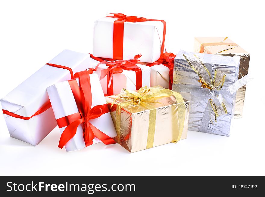 Holiday gift boxes decorated with ribbon isolated on white background.