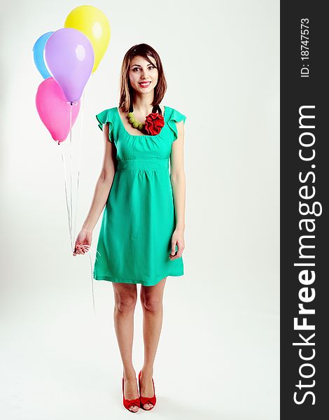 An image of young woman with birthday balloons. An image of young woman with birthday balloons