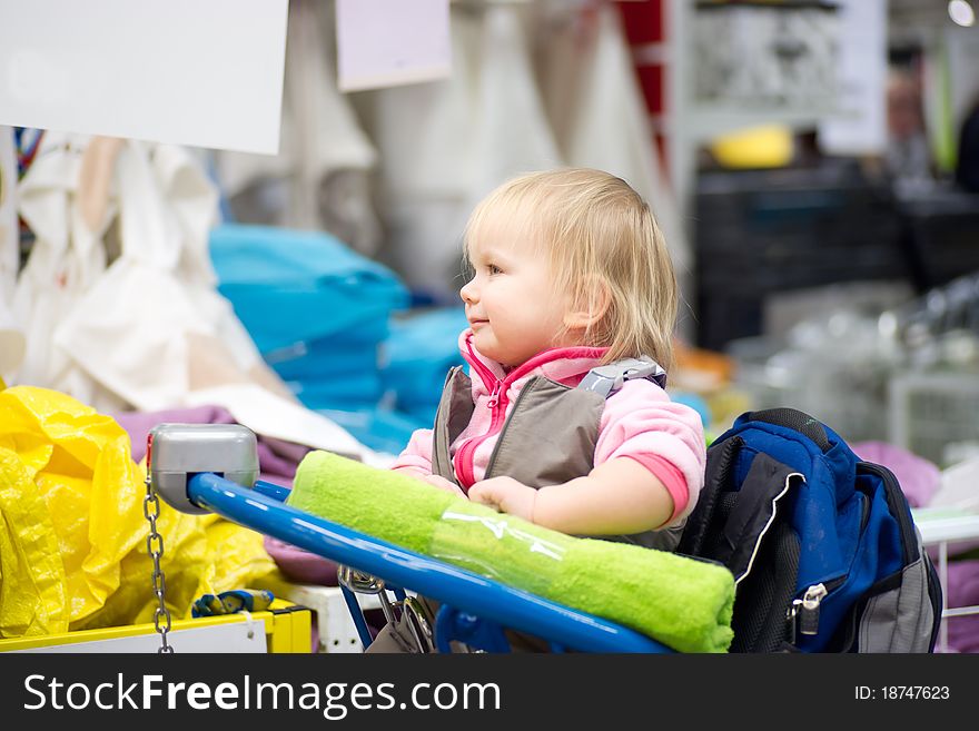 Young Aadorable Baby Sit On Shopping Cart