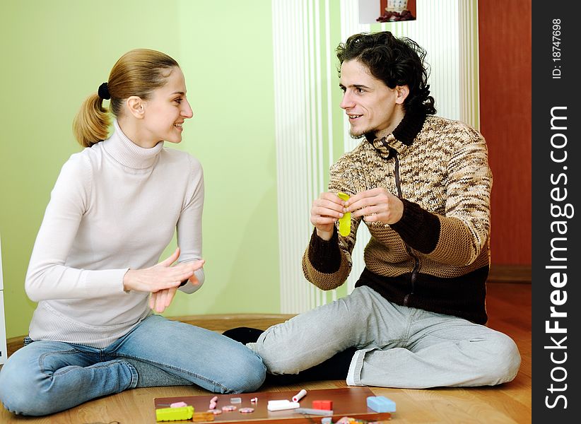 Young couple sculpts out of clay. Young couple sculpts out of clay