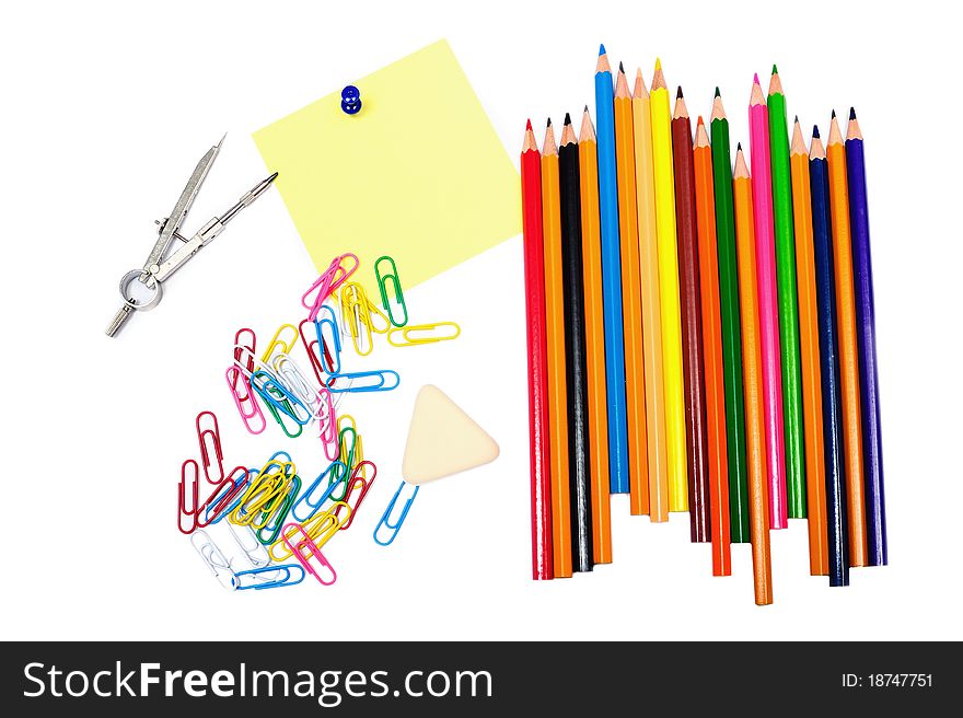 An image of pencils with clips and sheet of paper. An image of pencils with clips and sheet of paper