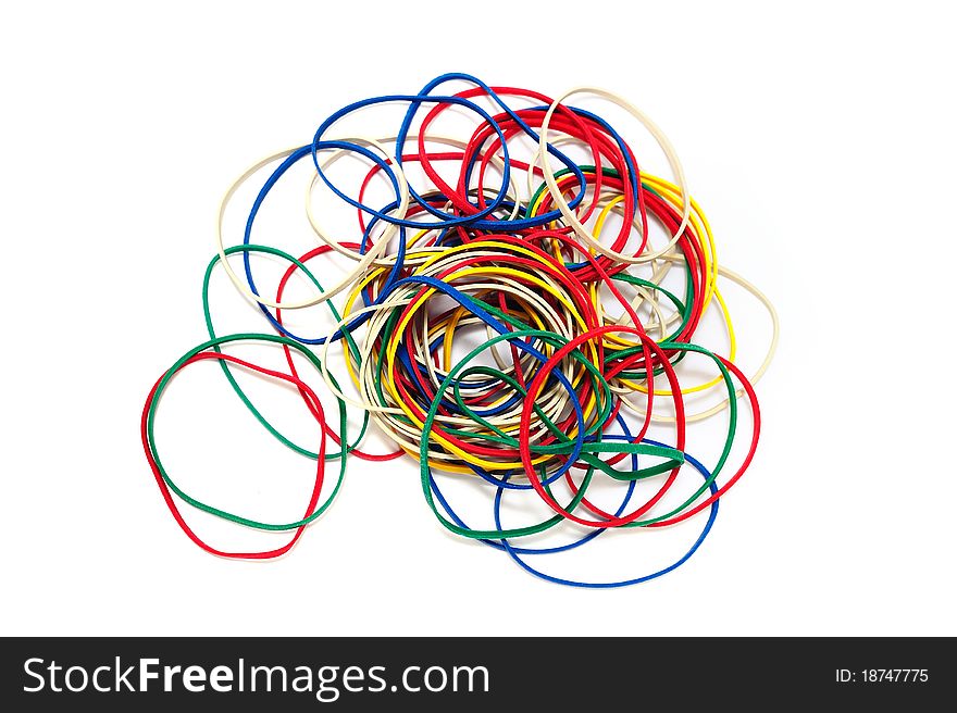 A pile of color rubber bands on a white background.