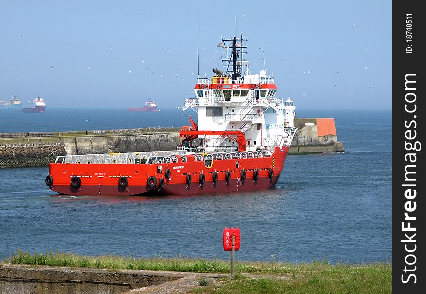 Oil supply ship leaving Aberdeen harbour. Oil supply ship leaving Aberdeen harbour