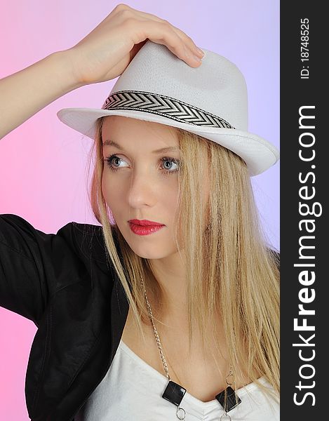 Beautiful european woman in a hat. colorfull background