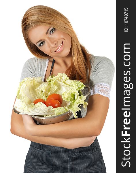 Happy young woman holding a pot of groceries