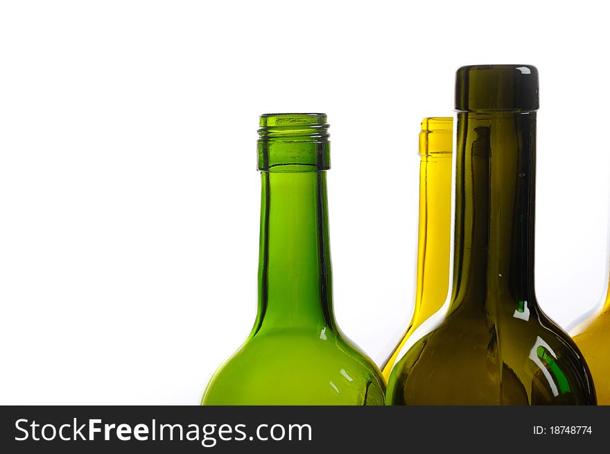 Many empty green wine bottles isolated on white
