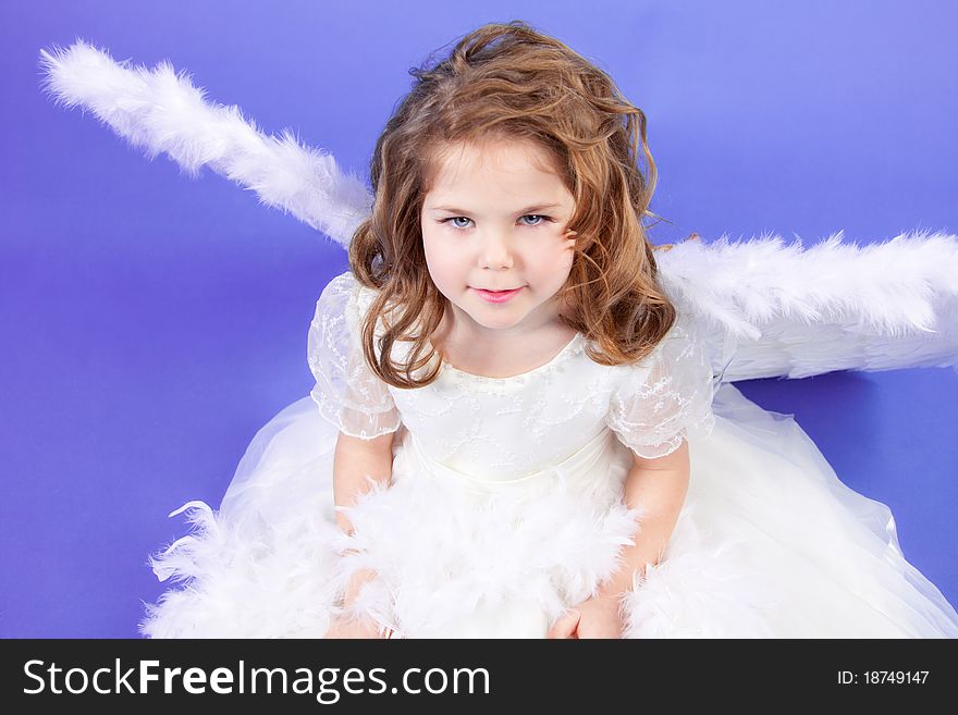 Beautiful girl in a white dress with angel wings. Beautiful girl in a white dress with angel wings