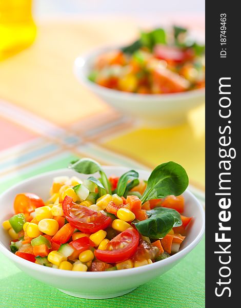 Fesh vegetable salad with corn,carrot,tomato,cucumber and sweet pepper