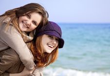 Two Happy Girls At Spring Beach. Stock Photo Two Happy Girls At Spring Beach. Stock Photo