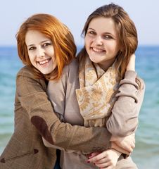 Two Happy Girls At Spring Beach. Royalty Free Stock Images