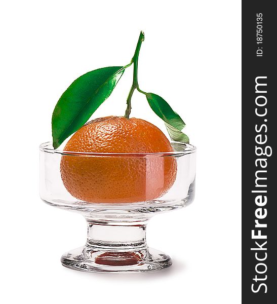 Tangerine in glasswares isolated on a white background