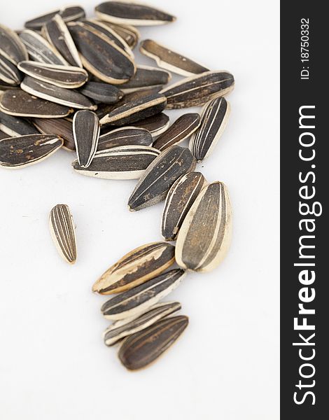 Sunflower seeds on white background.