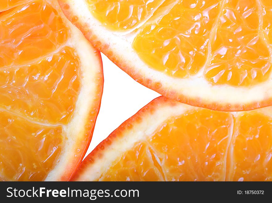 sliced â€‹â€‹ripe juicy orange closeup on white background