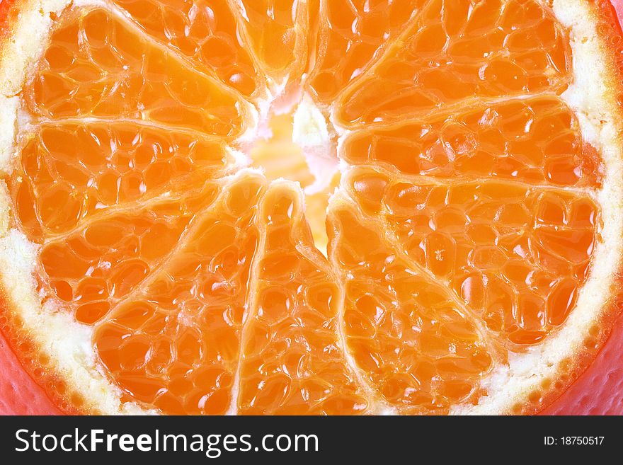 Sliced ​​ripe juicy orange  closeup on white background