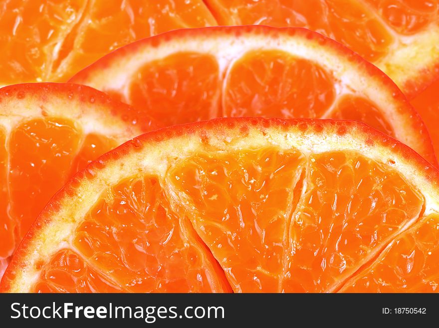 Sliced ​​ripe juicy orange close to the background
