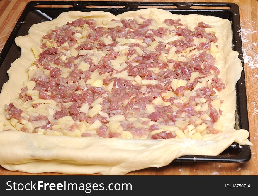 Raw meat pie is ready to bake in oven stove