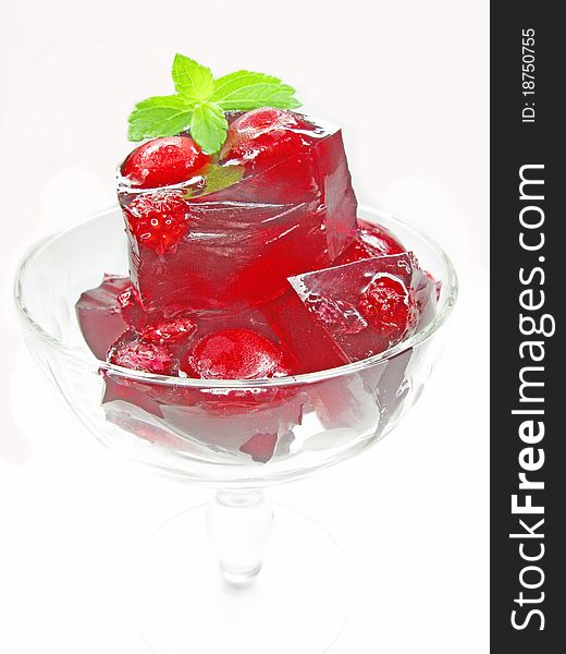 Red colored marmalade dessert with cherry. Red colored marmalade dessert with cherry