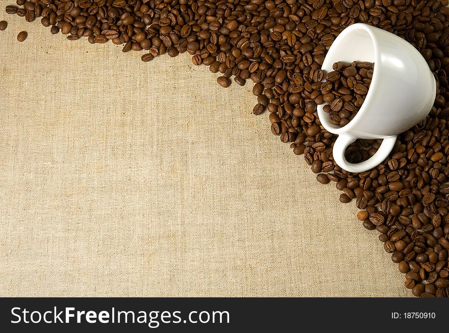 Coffee and cup on a fabric background. Coffee and cup on a fabric background.