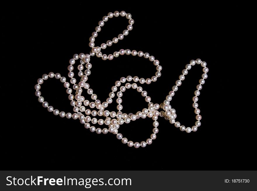 Pearl beads on a black background