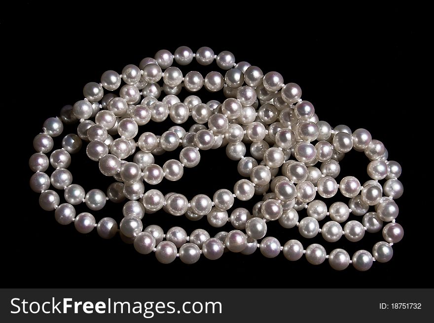 Pearl beads on a black background