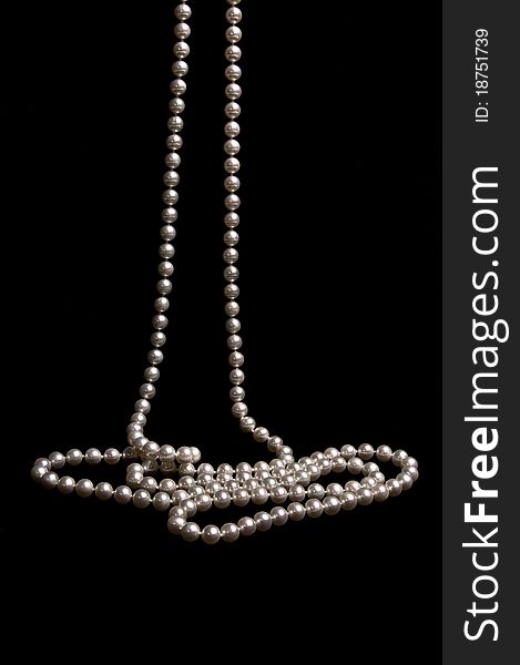 Pearl beads on a black background