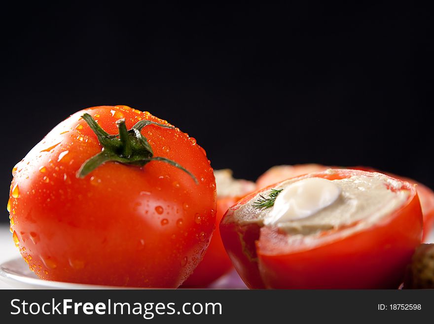 Tomato stuffed with vegetable filling. Tomato stuffed with vegetable filling