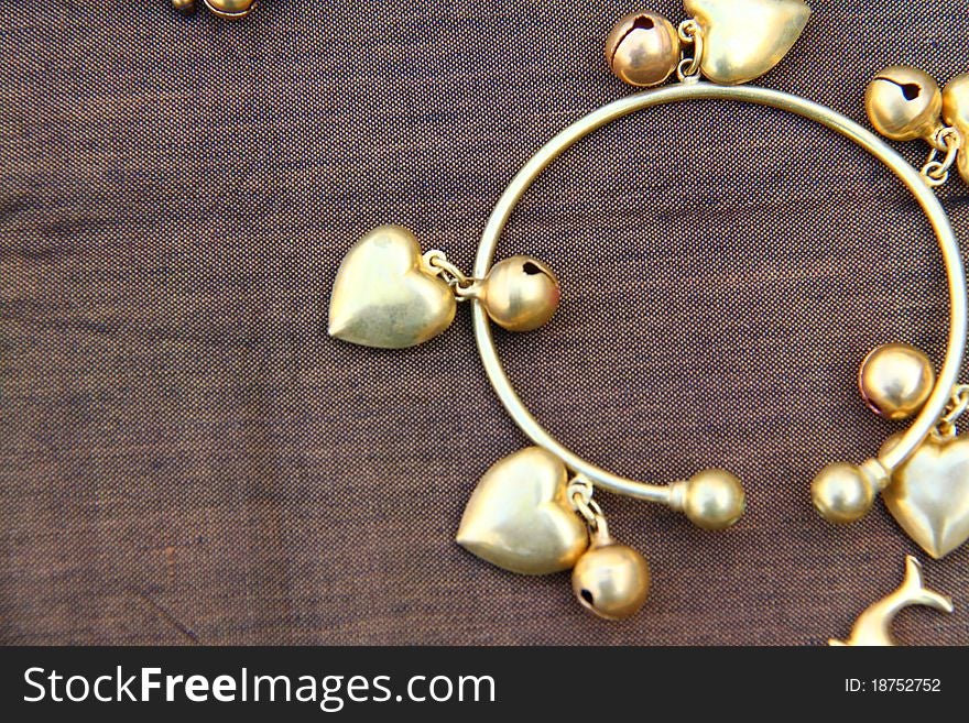 Stock image a golden bracelets on background