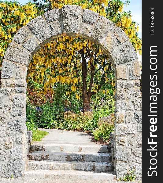 Stone archway in botanical garden. Stone archway in botanical garden