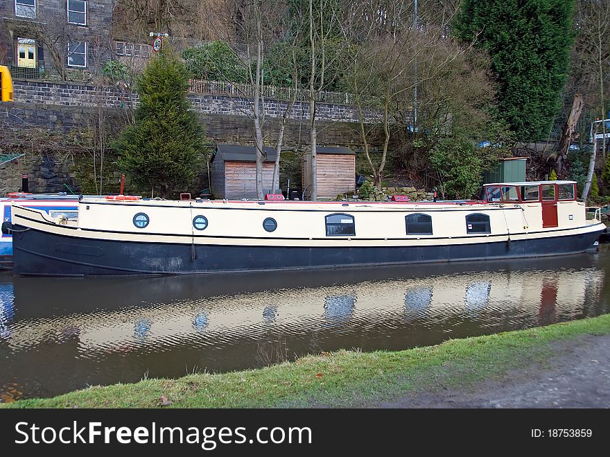 An old narrowboat on the Rochdale Canal at Hebden Bridge. An old narrowboat on the Rochdale Canal at Hebden Bridge