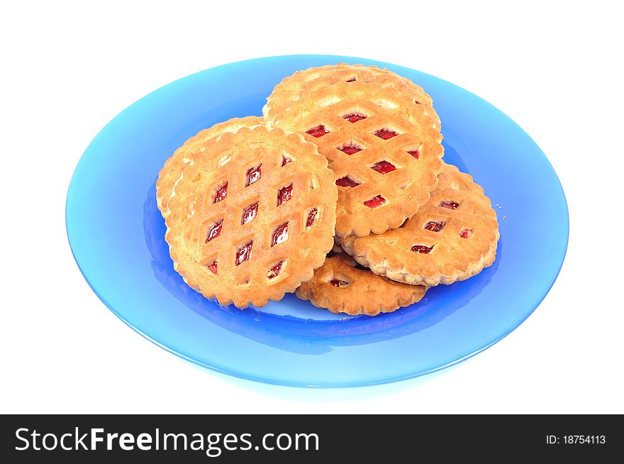 Cookies on a blue plate , isolated on a white background