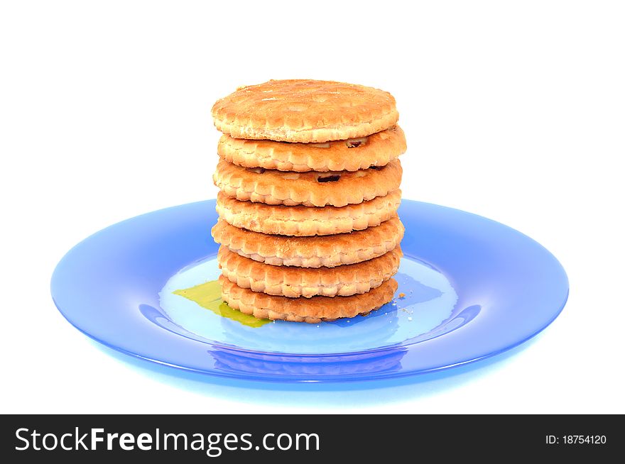 Cookies on a blue plate , isolated on a white background