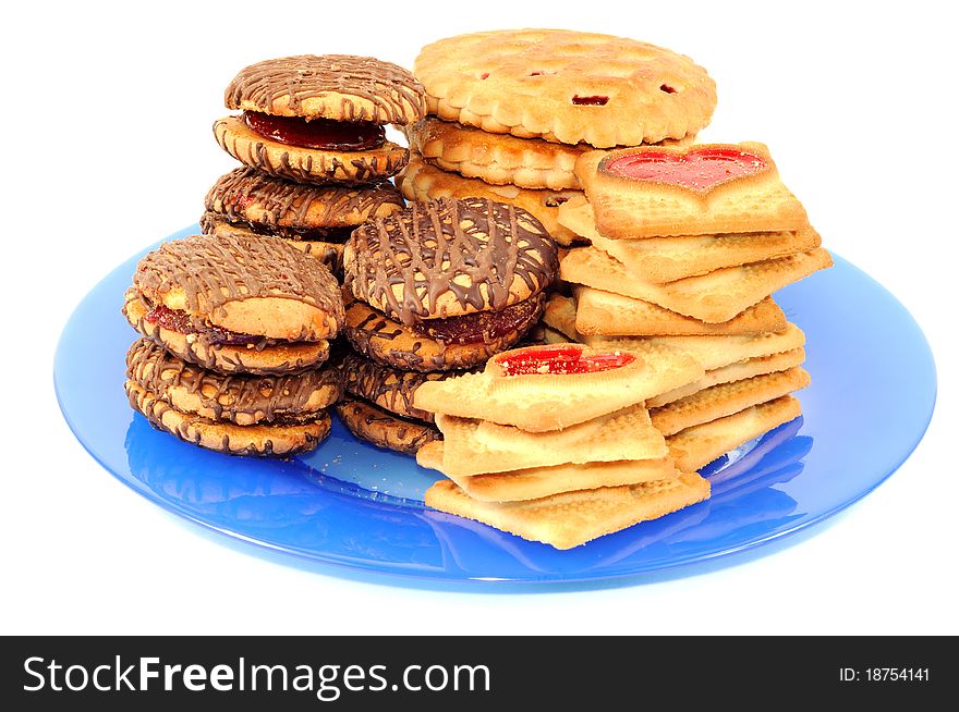 Cookies on a blue plate , isolated on a white background. Cookies on a blue plate , isolated on a white background