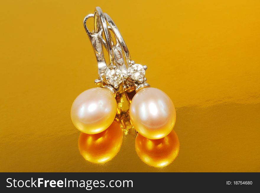 White gold earrings with white pearls and diamonds. White gold earrings with white pearls and diamonds