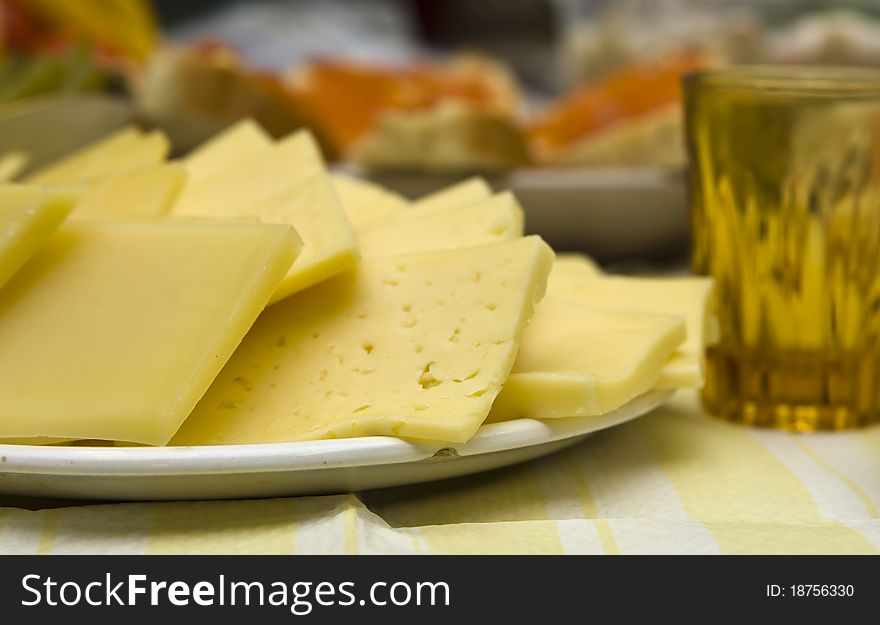 Pieces of sliced cheese on the festal table. Pieces of sliced cheese on the festal table