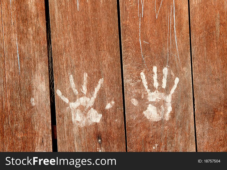 Blown wood wall with white hand print. Blown wood wall with white hand print