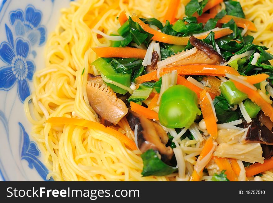 Vegetable noodles with colorful ingredients for a nutritious dish. Vegetable noodles with colorful ingredients for a nutritious dish.