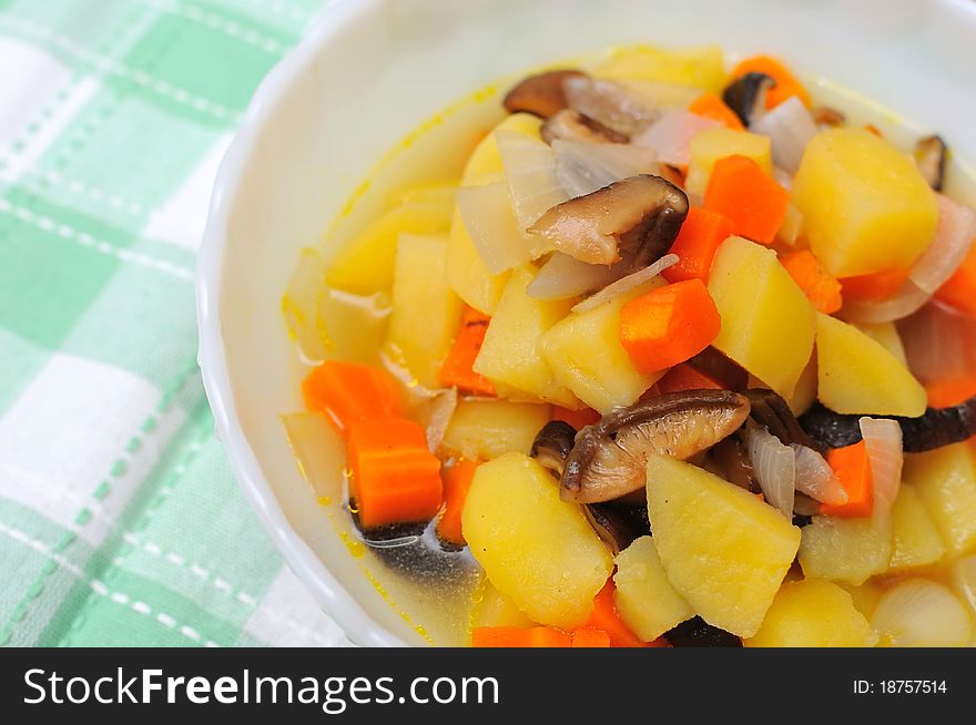 Homemade potato stew cooked with carrots and mushrooms. Homemade potato stew cooked with carrots and mushrooms.