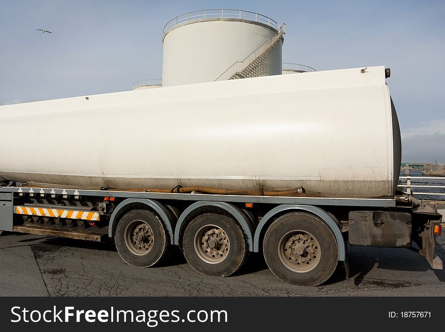 Fuel Truck and industrial petrol storage tanks, detail. Fuel Truck and industrial petrol storage tanks, detail