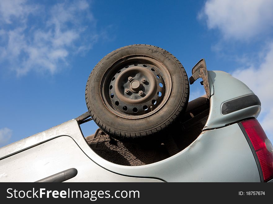 Car part, turned upside-down after road collision. Car part, turned upside-down after road collision