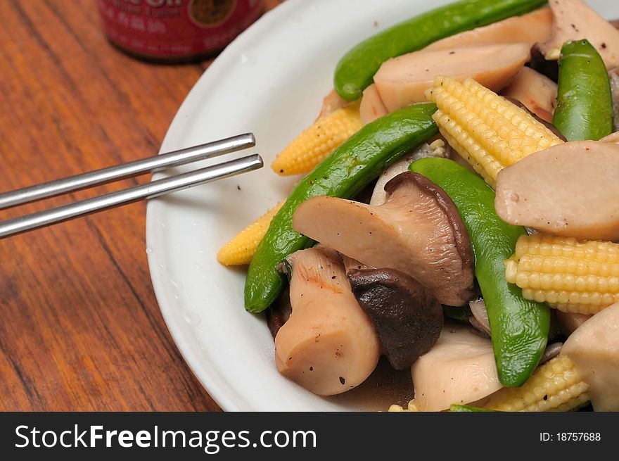 Simple Chinese style dish with healthy mushrooms and mixed vegetables. Simple Chinese style dish with healthy mushrooms and mixed vegetables.